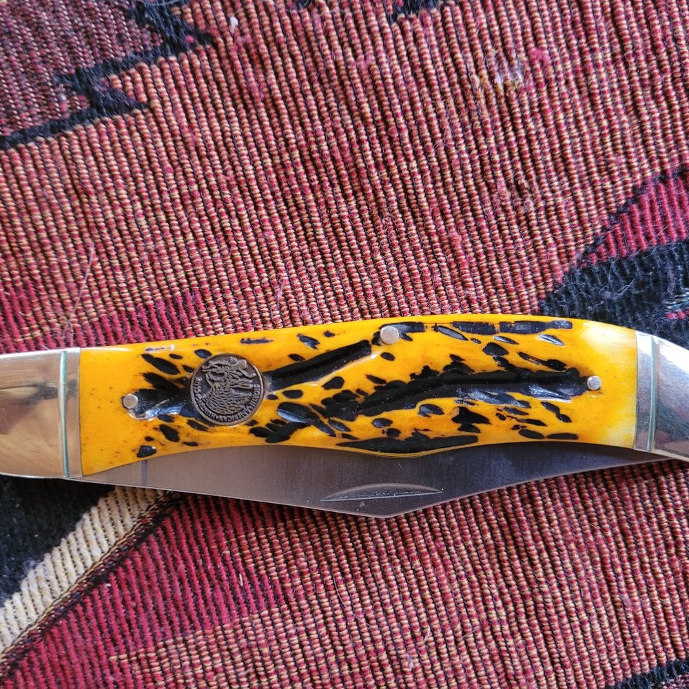 NAHC Hunters Classic folding knife with bone handle.